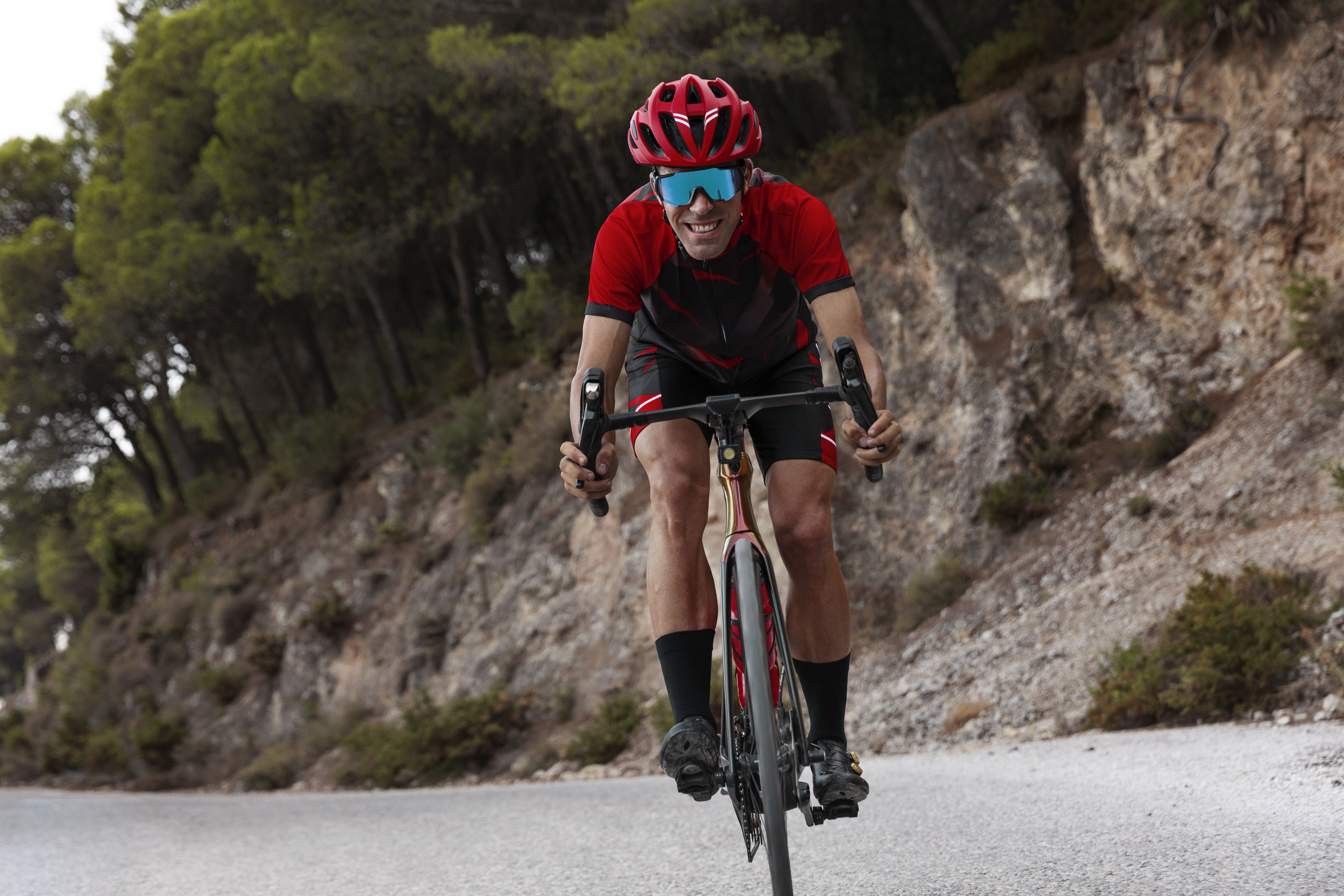 male-cyclist-with-helmet-training-bicycle-outdoors